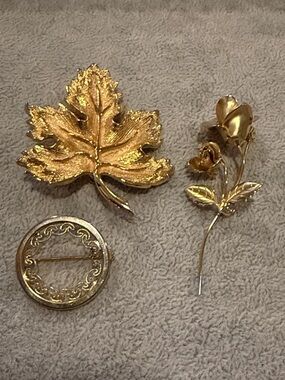 Lot of 3 Gold Tone Brooches, Leaf, Rose and decorative circle